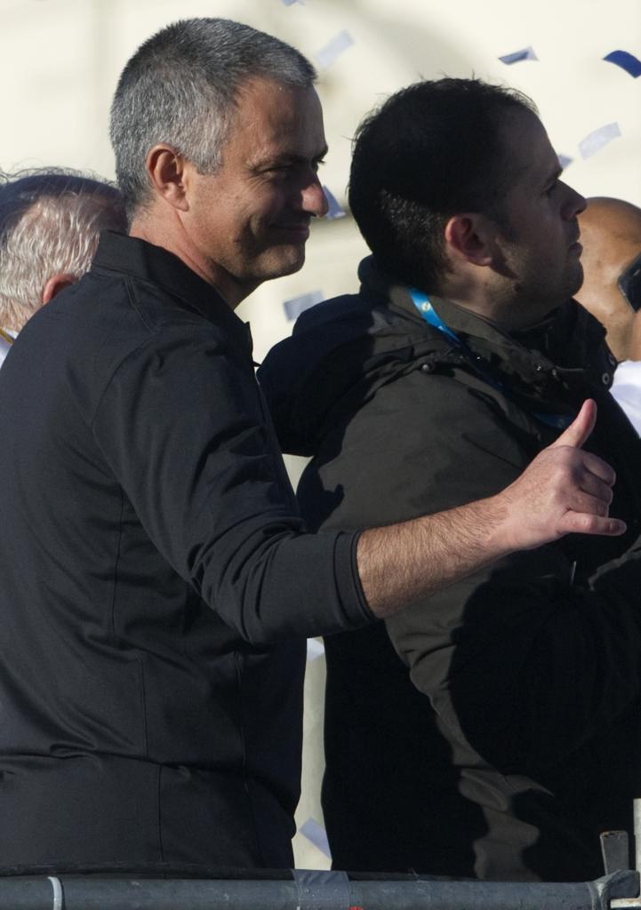 Real Madrid's coach Jose Mourinho gestures as he walks around Cibeles statue in central Madrid