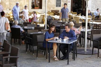 Britain's Prime Minister David Cameron and his wife Samantha sit at a cafe during a holiday in Majorca, Spain