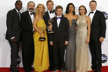 The cast of "Homeland" pose after the series won the Emmy award for outstanding drama series at the 64th Primetime Emmy Awards i