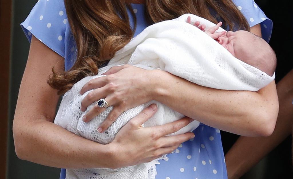 Britain's Catherine, Duchess of Cambridge appears with her baby son outside the Lindo Wing of St Mary's Hospital, in central Lon