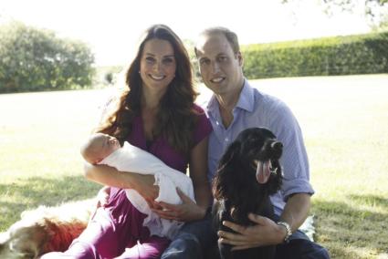 Britain's Prince William and his wife Catherine, Duchess of Cambridge, pose with their son Prince George in the garden of the Mi