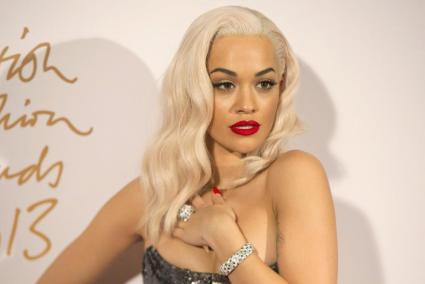 British singer Rita Ora poses for photographs at the British Fashion Awards in London