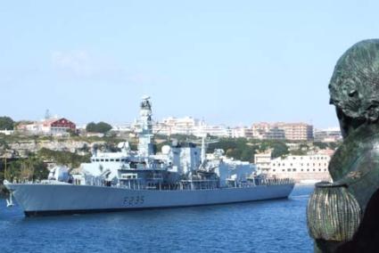 Fond Farewell. HMS Monmouth passes the Collingwood bust on the Illa del Rei - Menorca Britannia