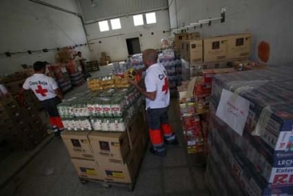 EU Surplus. Volunteers making up food packs from 23 tons supplied by the European Union