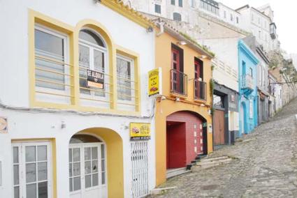 Desolate. Closed outlets and abandoned buildings paint a sad picture in the port of Maó