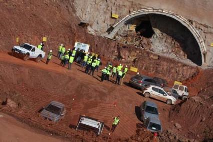 Breakthrough. The excavator removing the final layer of rock from the tunnel