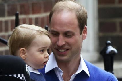 Britain's Prince William returns with his son George to the Lindo Wing of St Mary's Hospital, after the birth of his daughter in