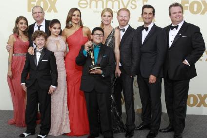 The cast of "Modern Family" pose backstage at the 63rd Primetime Emmy Awards in Los Angeles