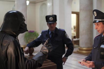 A local resident dressed as the Star Wars Darth Vader visits the mayor's office in Odessa