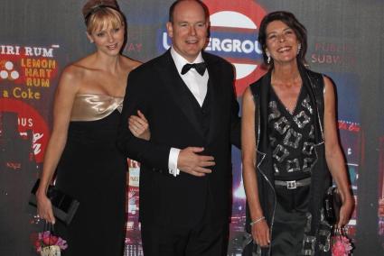 Prince Albert II of Monaco, his wife Princess Charlene and Princess Caroline of Hanover arrive to attend the Rose Ball in Monte